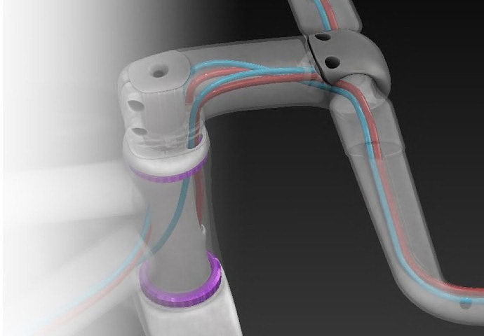 ロードバイクの内装ケーブルルーティング構造を示した透視図。ハンドルからヘッドチューブを通る配線が整理され、空力性能と美しいデザインを両立させている。